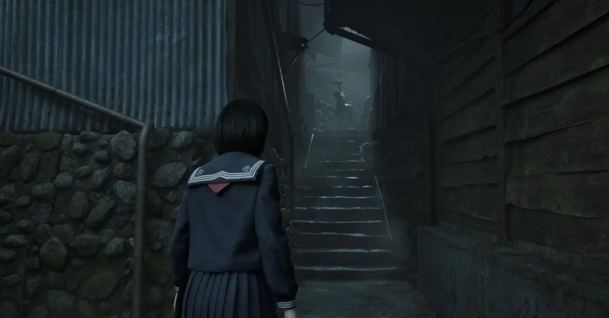 Silent Hill f main character staring at a shadowy figure on the stairs in a fog-filled daytime horror environment