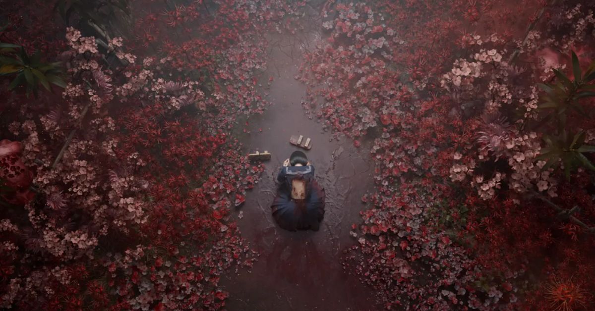 An overhead view from Silent Hill f shows a girl in a Japanese school uniform kneeling on a cracked pathway, surrounded by an eerie field of red and pink flowers. Her back appears wounded, with something unnatural growing from it. Small wooden objects, possibly toys or relics, lie in front of her. The atmosphere is haunting, with the vibrant yet ominous floral overgrowth contrasting against the dark, damp ground. The scene evokes a sense of sorrow and transformation, hinting at the horror that lurks within the beauty.