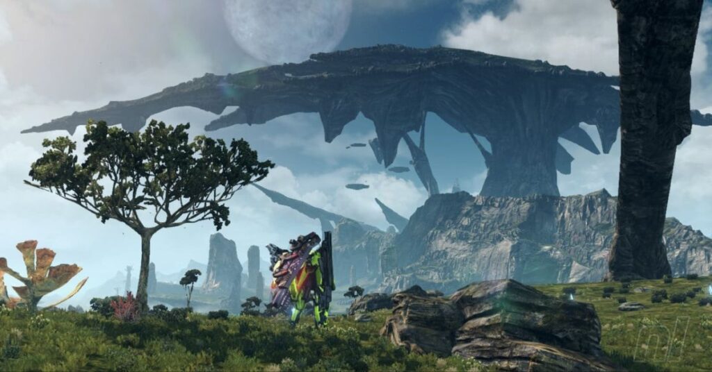 A stunning landscape from *Xenoblade Chronicles X*, featuring a player character in advanced armor standing in a vast open field. A massive floating landmass dominates the sky, with alien flora and rock formations scattered across the terrain. The scene is bathed in soft natural light, enhancing the game's sci-fi fantasy aesthetic.