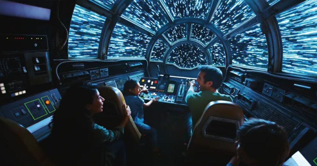 First look inside the Millennium Falcon: Smugglers Run ride at Star Wars: Galaxy's Edge in Disneyland, showcasing the iconic cockpit and immersive Star Wars-themed controls and seating.